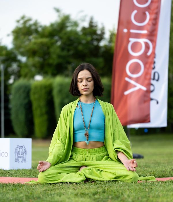 Woman in a calm yoga pose, embodying balance and serenity.
